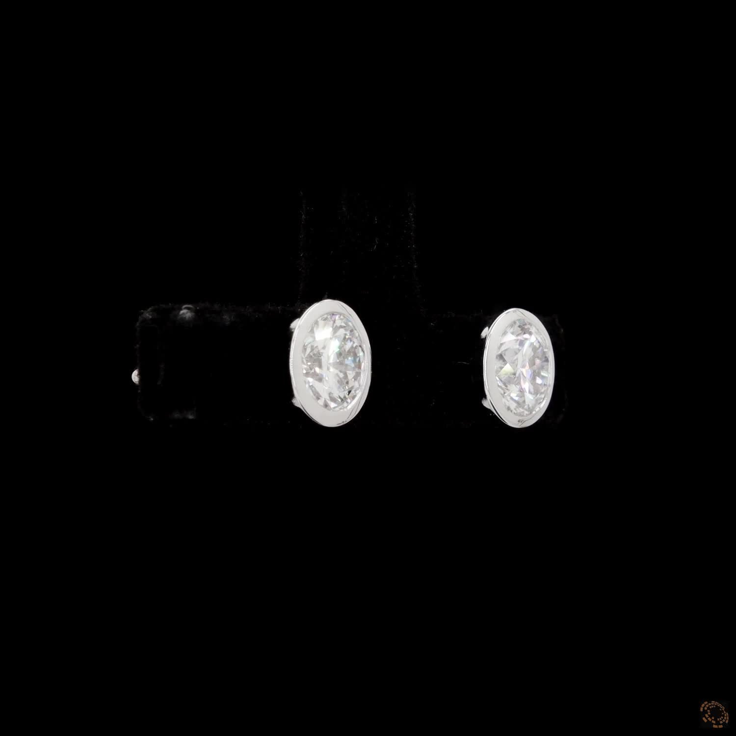 2.21 Bezel-Set Oval Cut Diamond Stud Earrings in White Gold