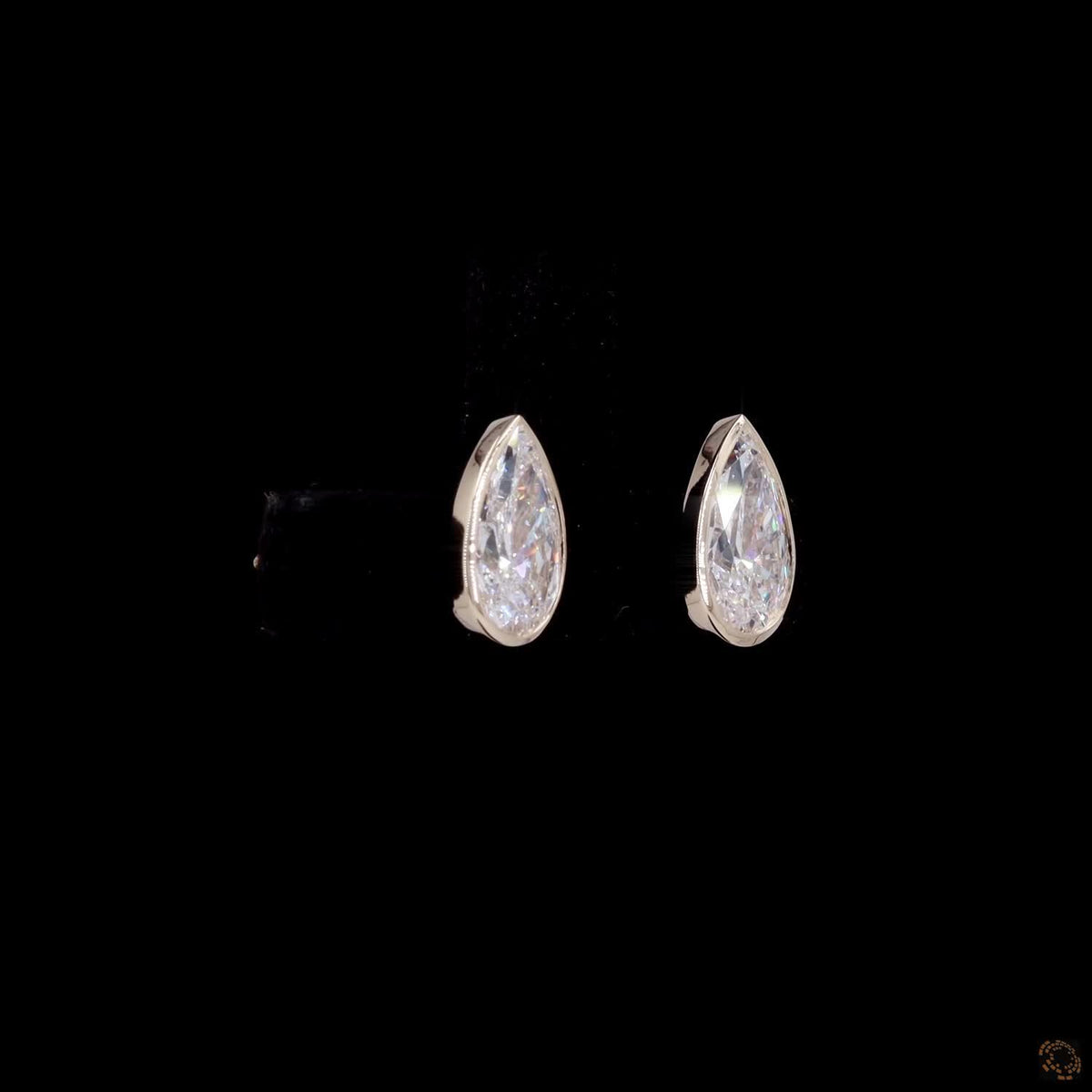 2.14 Ct Bezel-Set Pear Cut Solitaire Diamond Stud Earrings in Yellow Gold