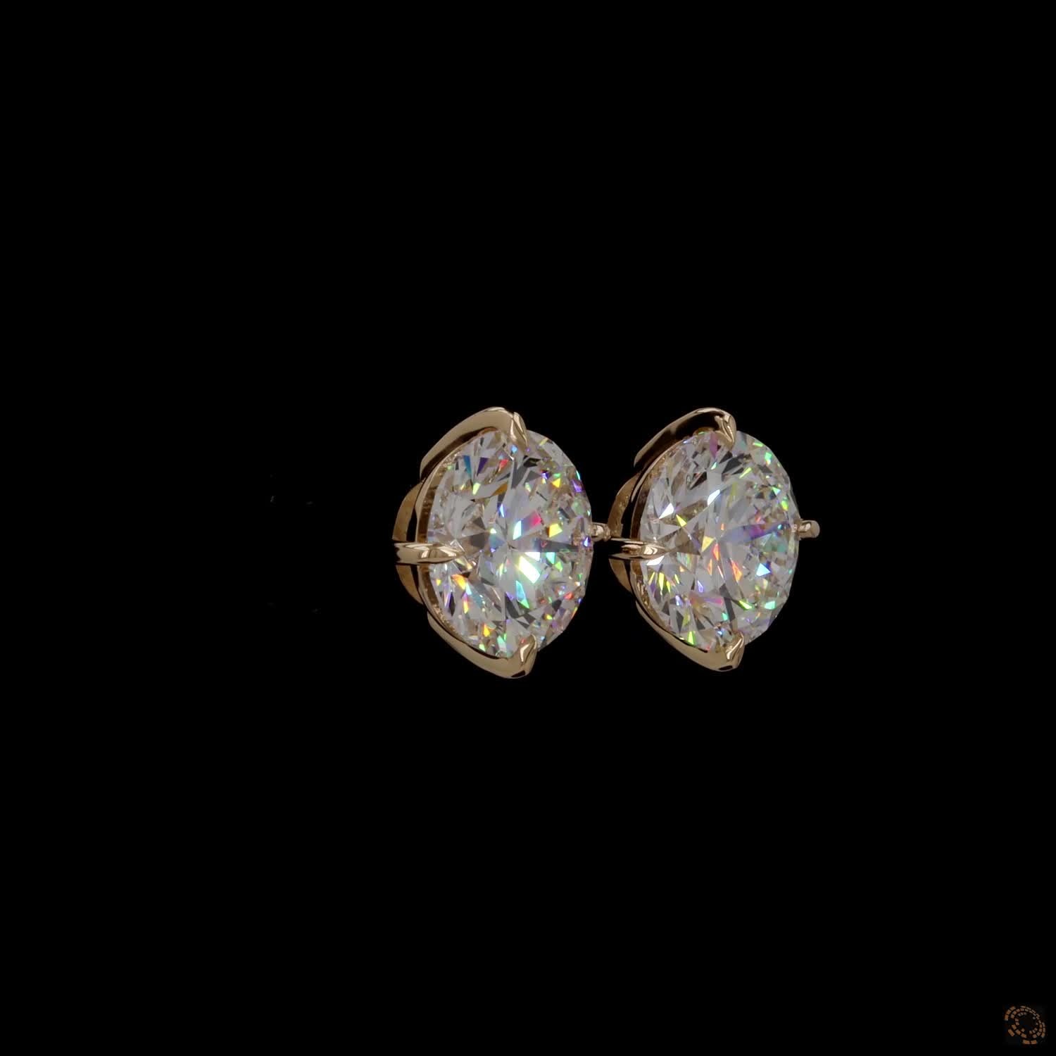 12.07 Ct Minimalist single-stone solitaire studs set in a delicate, architectural basket mount