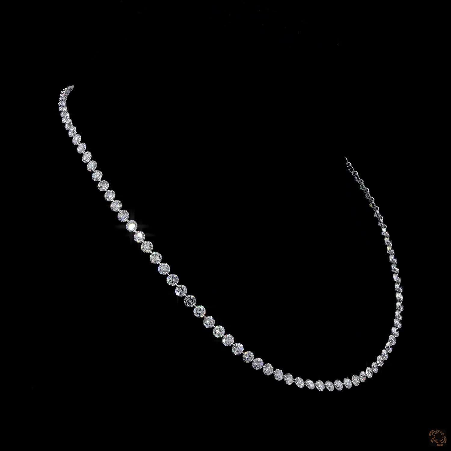 9.78 Ct Half-graduated tennis necklace featuring a continuous row of round brilliant diamonds that gracefully enlarge along the front drop