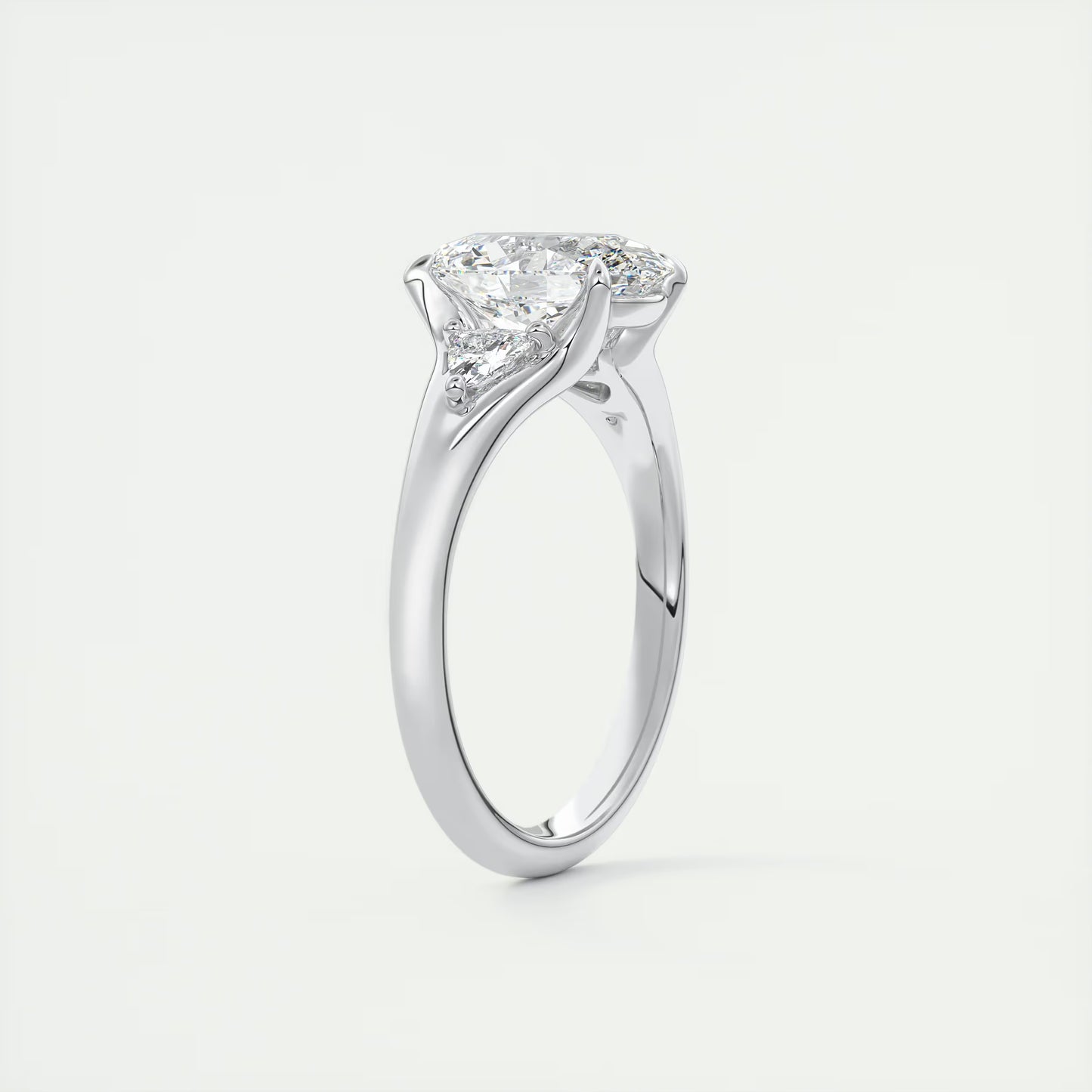 2.30 Ct The Symphony Oval  & Trilliant Split Shank Three Stone Engagement Rings