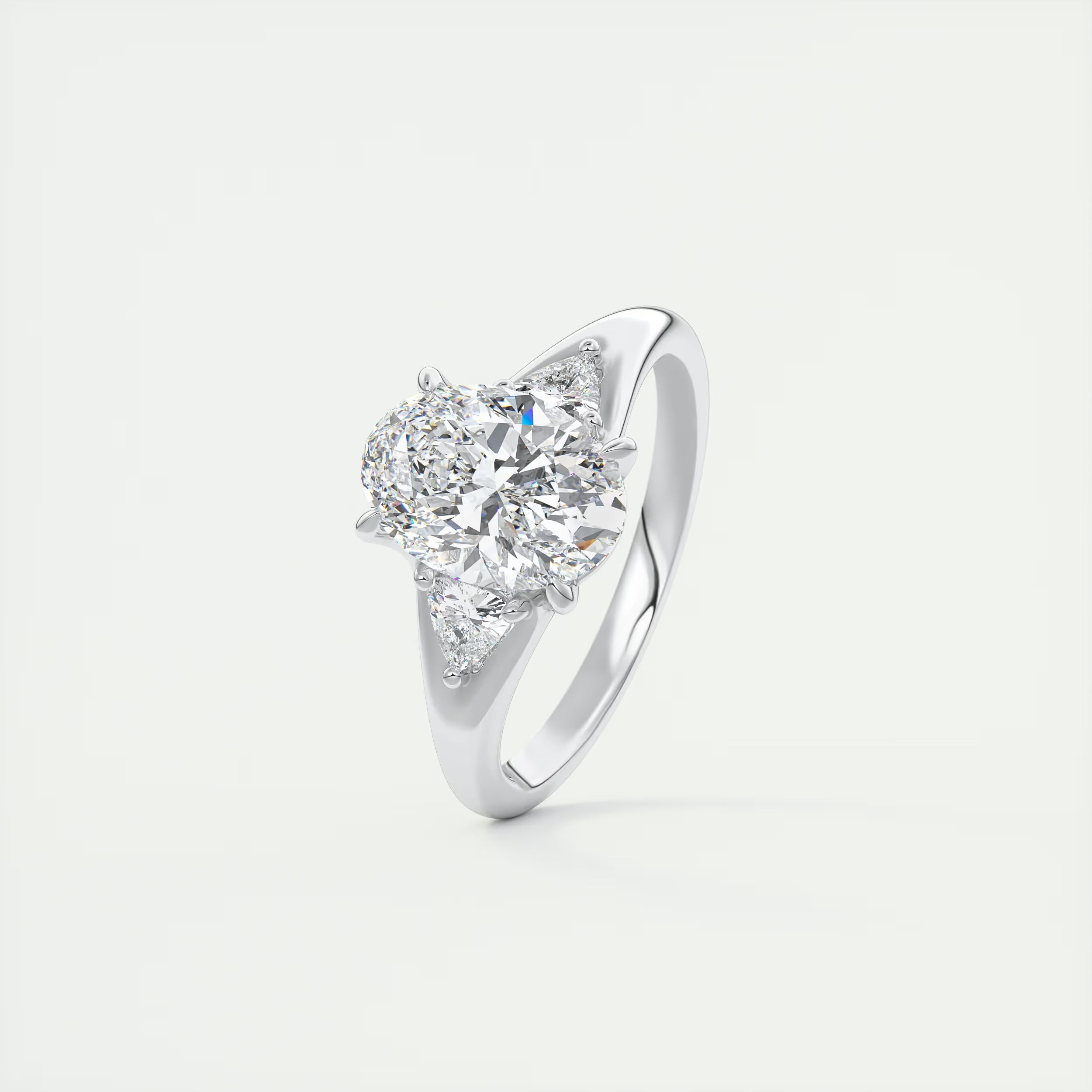2.30 Ct The Center Stone Oval  & Side Stone Trilliant Split Shank Three Stone Engagement Rings