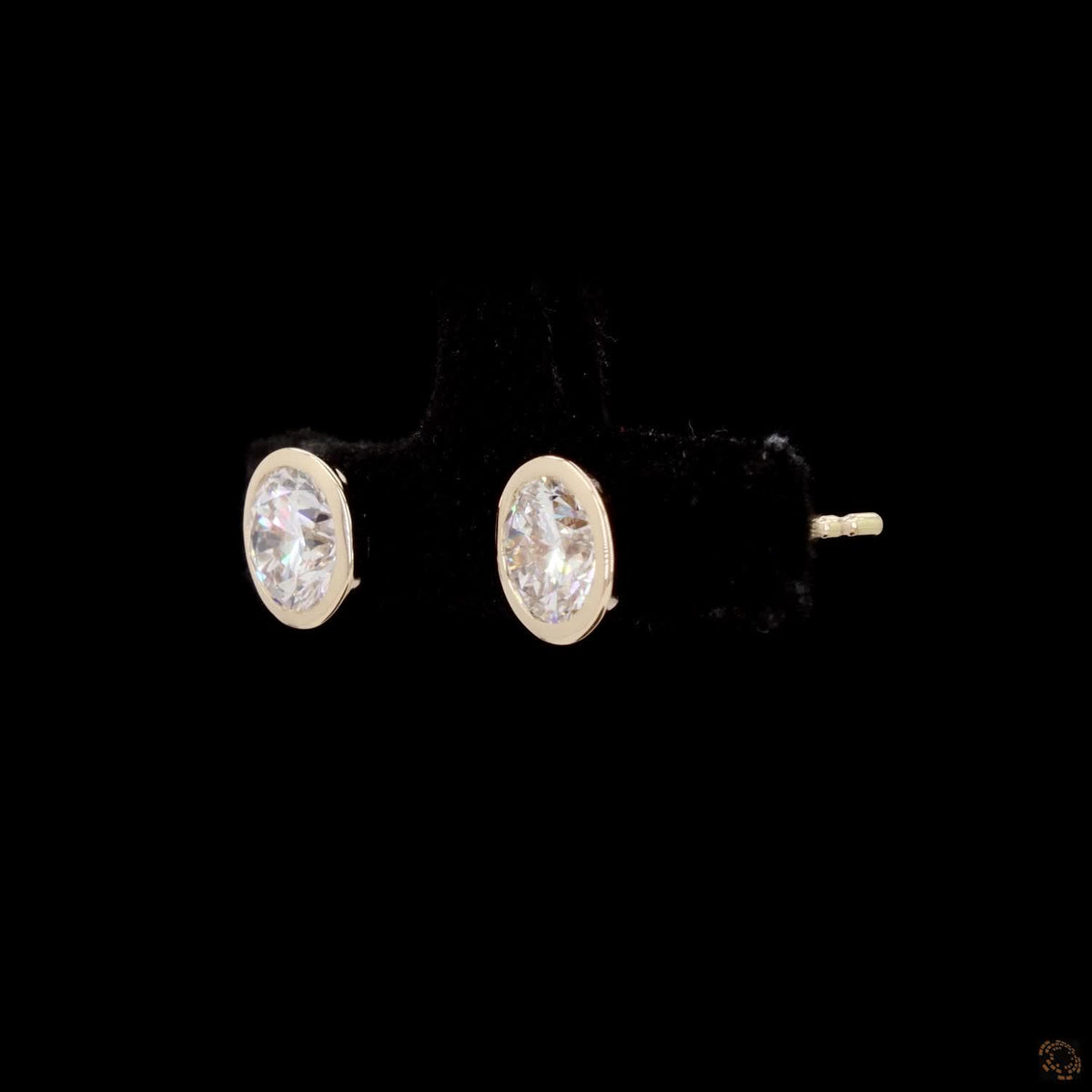 1.47 Bezel-Set Oval Cut Diamond Stud Earrings in Yellow Gold