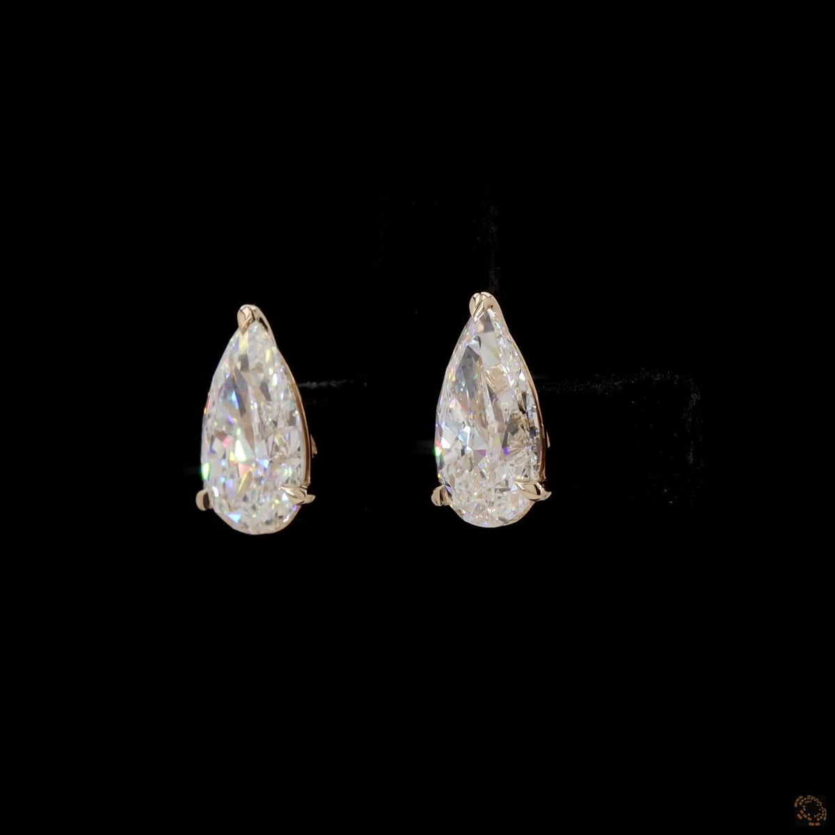 4.00 Ct Three-Prong Pear Cut Diamond Stud Earrings in Yellow Gold