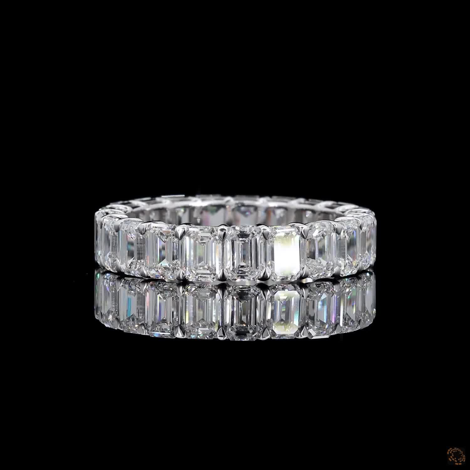 5.39 Ct Step-cut Emerald Diamonds continuously set around the full band