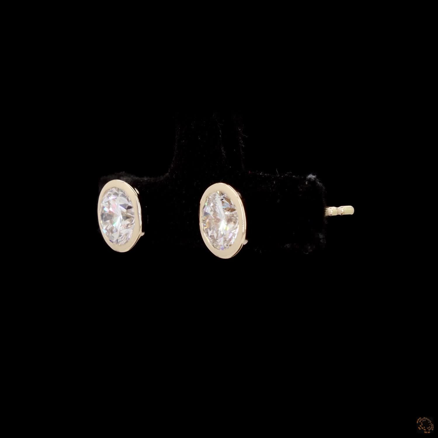 2.18 Bezel-Set Oval Cut Diamond Stud Earrings in Yellow Gold