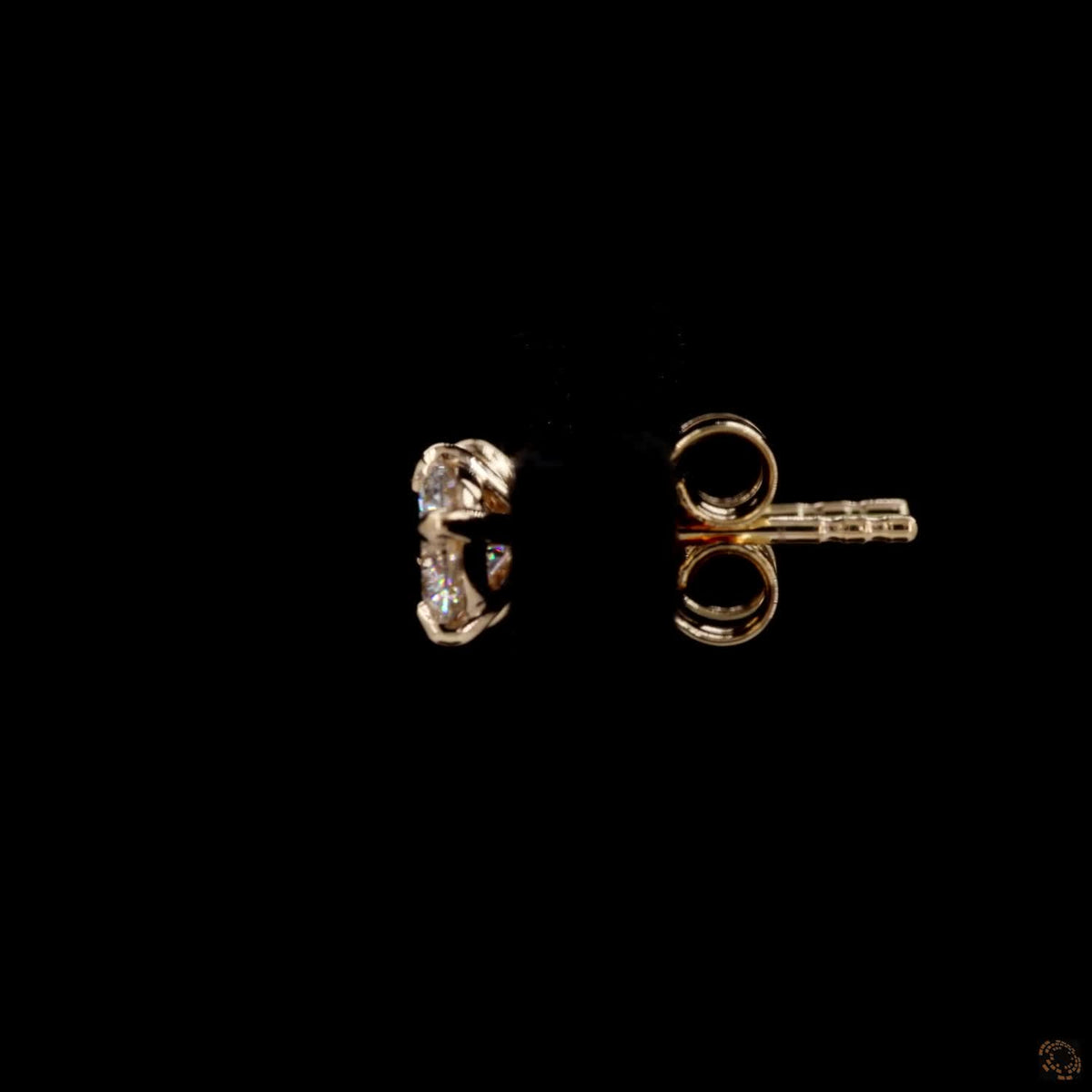 1.01 Ct Shop classic round brilliant solitaire diamond stud earrings set in 4-prong yellow gold basket settings with comfortable friction push-back closures