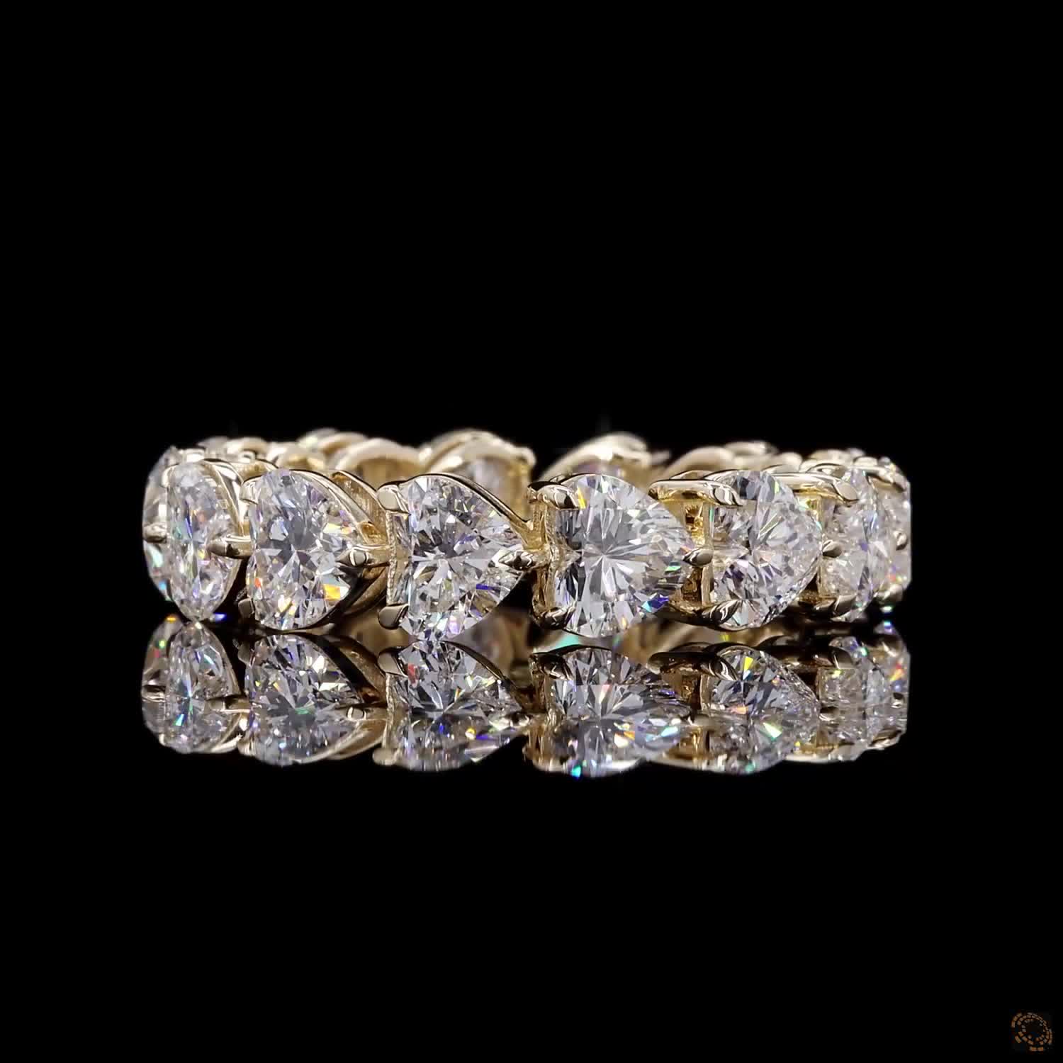 5.44 Ct Full eternity band featuring a continuous row of horizontally aligned east-west oriented heart-cut diamonds seamless set end-to-end around the entire band