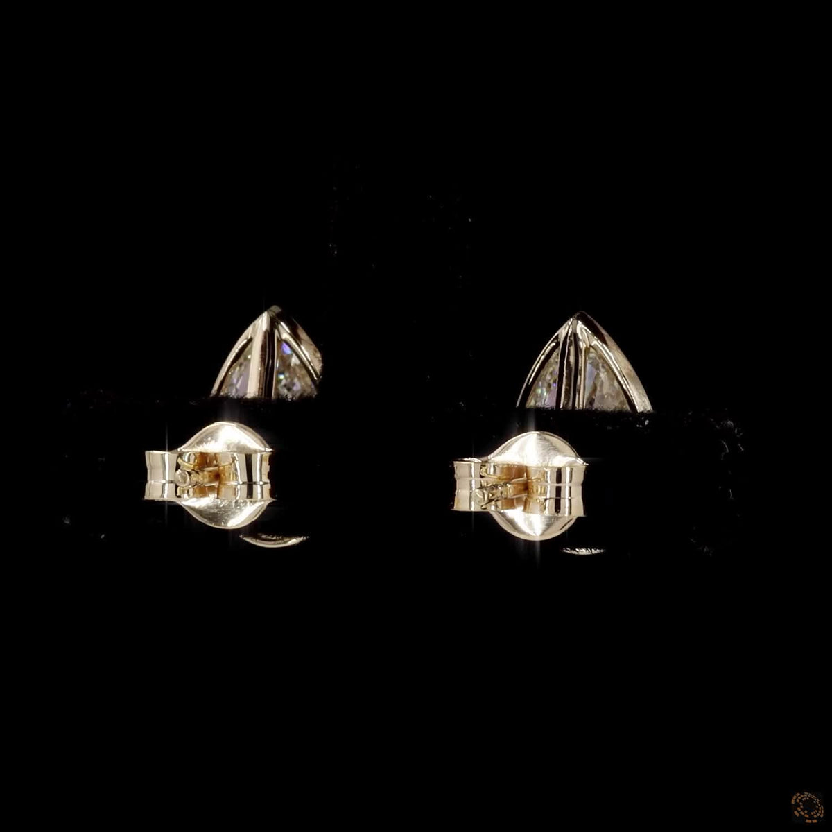 3.04 Ct Upgrade your signature collection with sleek bezel-set pear-cut solitaire diamond stud earrings in yellow gold, featuring a protective metal rim setting and comfortable push-back closures