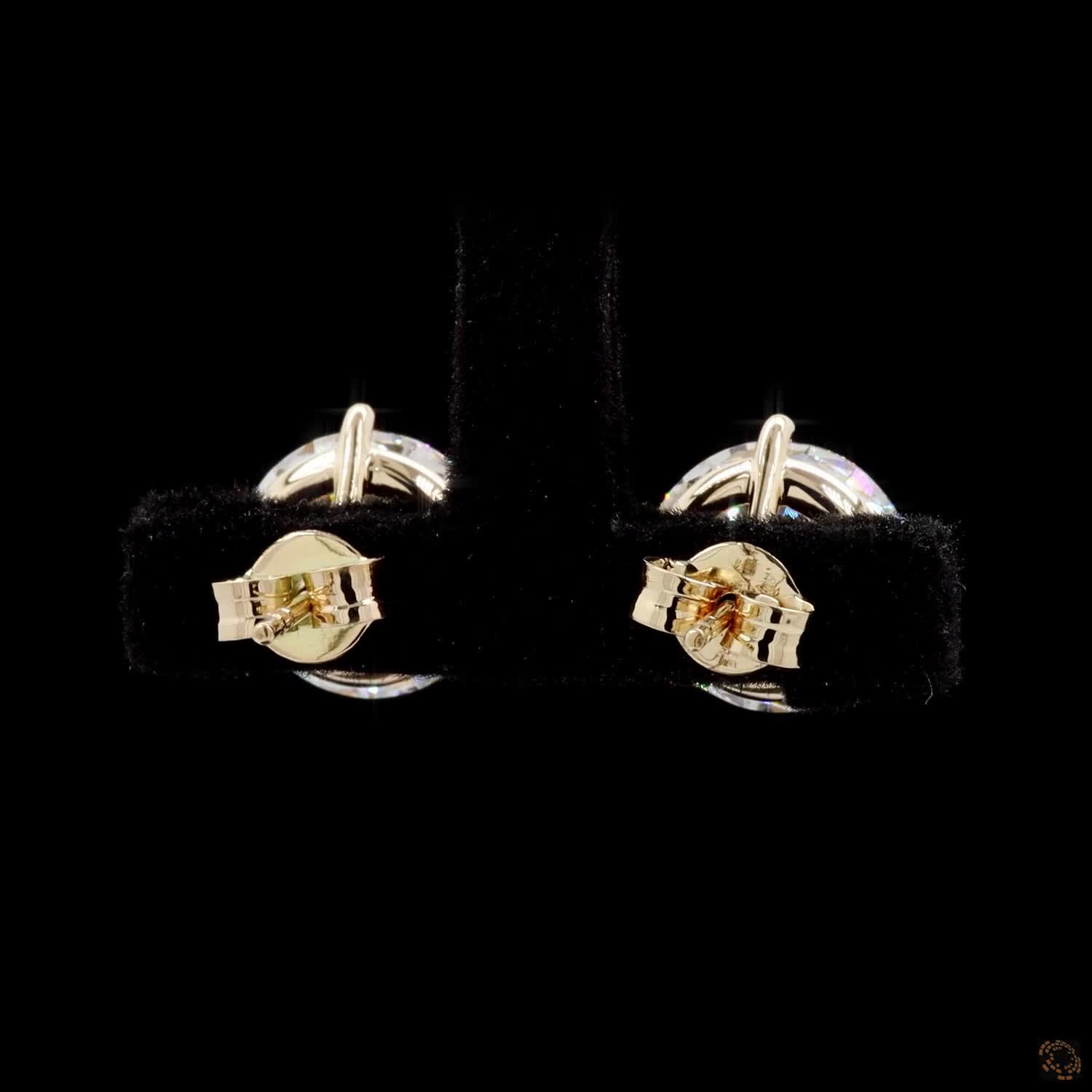8.10 Ct Pair of solitaire stud earrings featuring round brilliant-cut diamonds