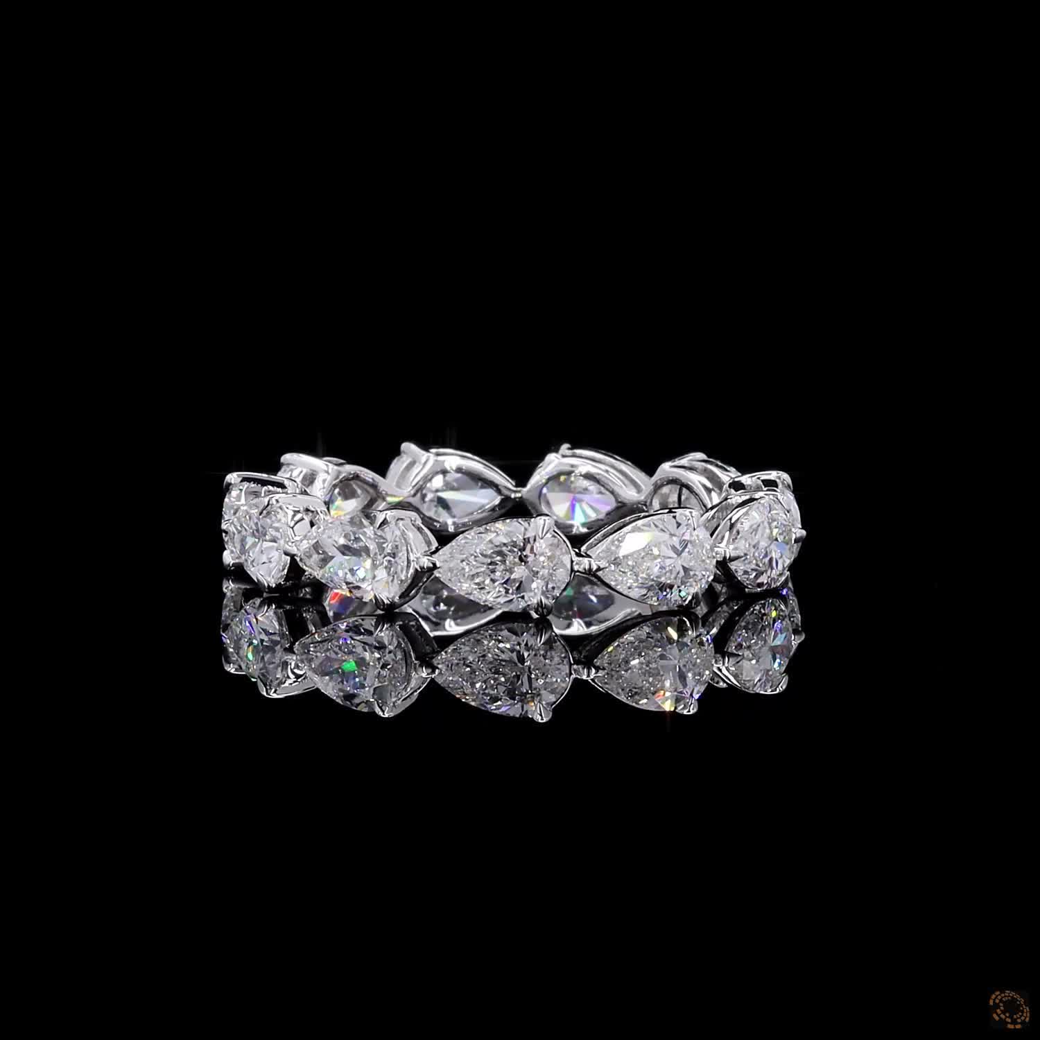 2.72 Ct Full eternity band featuring horizontally set East-West style pear-cut diamonds connected in an alternating head-to-tail arrangement