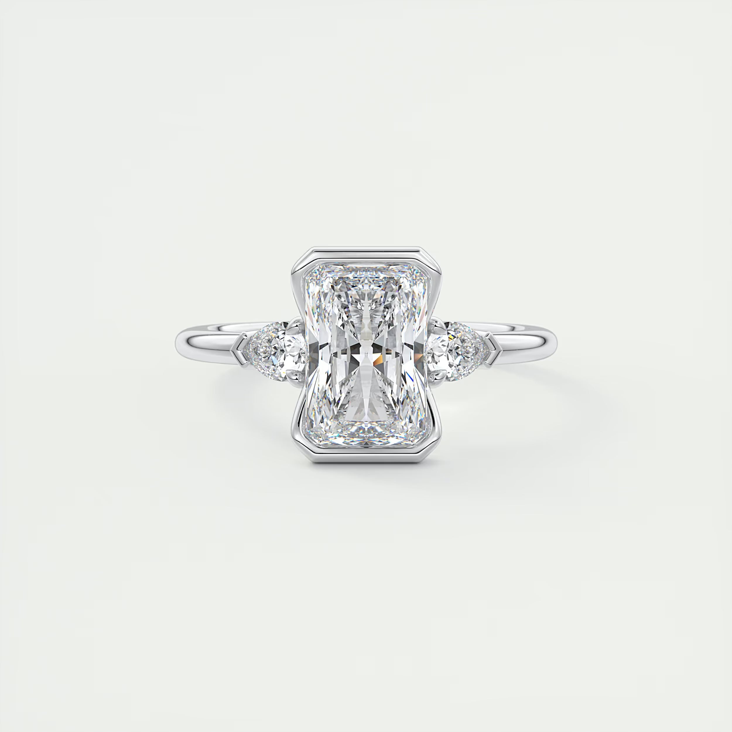 2.50 Ct Clutch Radiant & Pear Three Stone Engagement Rings