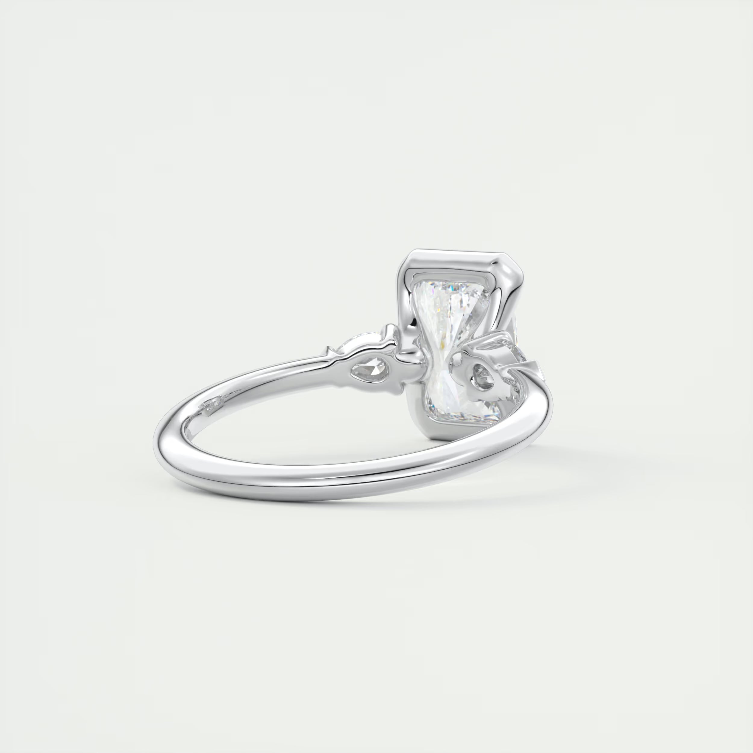 2.50 Ct Clutch Radiant & Pear Three Stone Engagement Rings