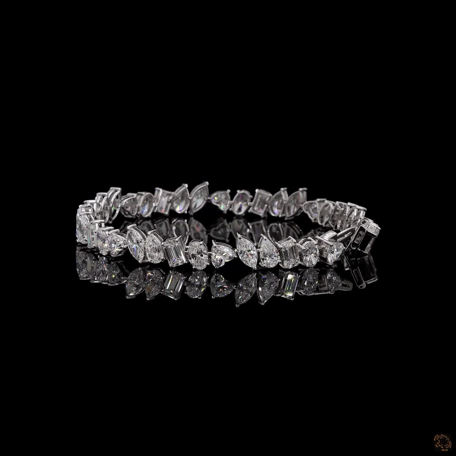 12.62 Ct  Features an alternating sequence of fancy-cut stones, including marquise, emerald, pear, oval, and heart/triangular cuts.