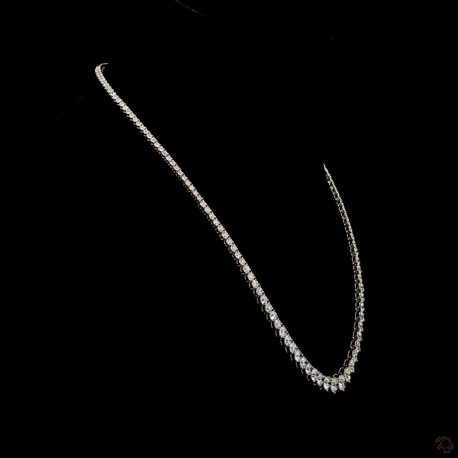 29.06 Ct Round Brilliant Cut diamonds seamlessly graduated from larger center stones down to smaller accent diamonds toward the back