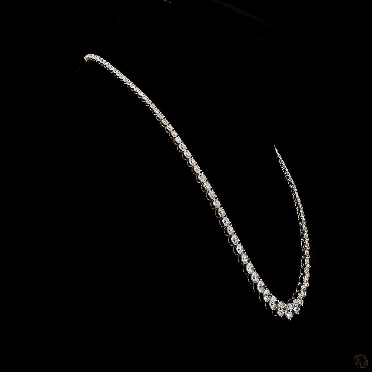 17.79 Ct Round Brilliant Cut diamonds arranged in a dramatic graduated layout tapering toward the back
