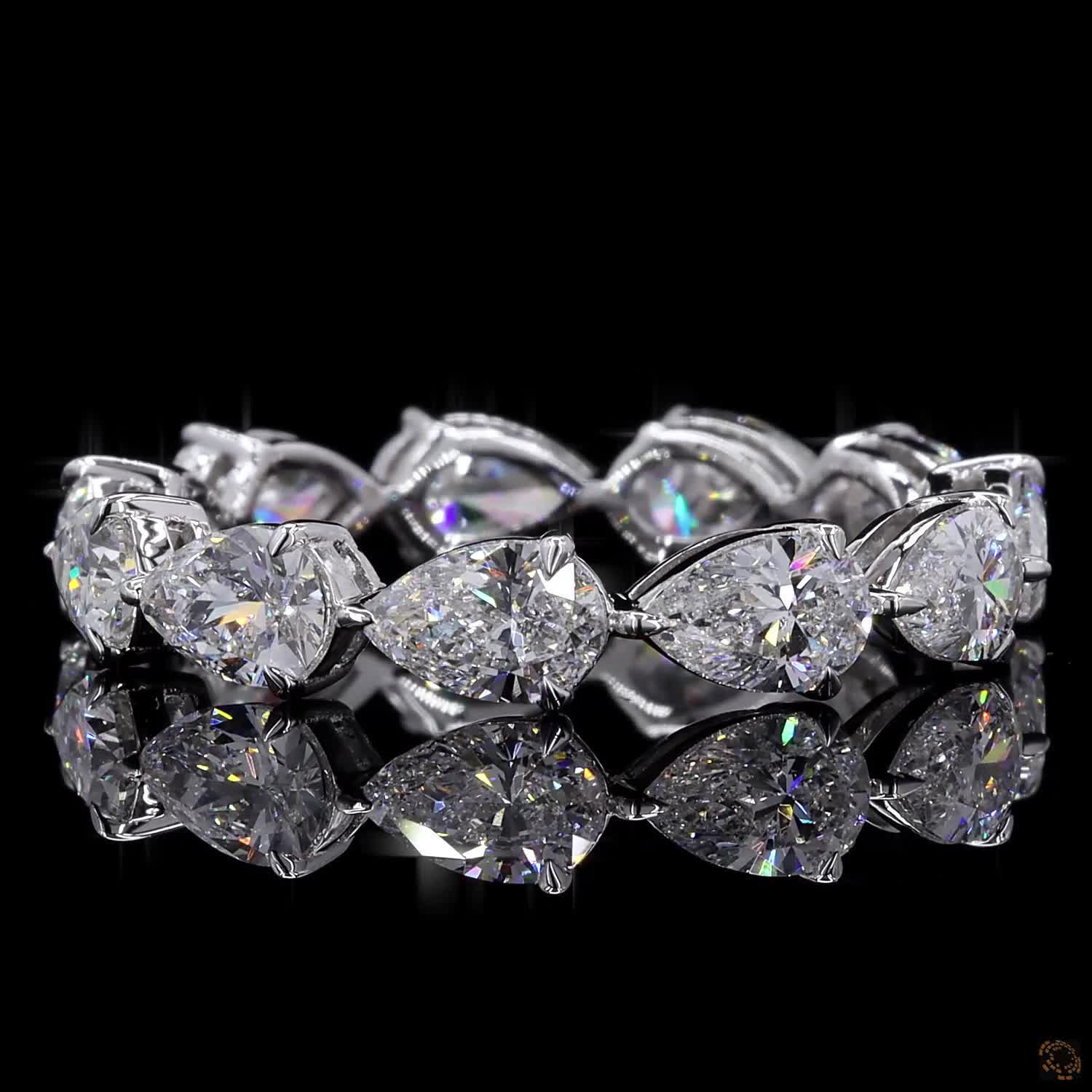 2.72 Ct Full eternity band featuring horizontally set East-West style pear-cut diamonds connected in an alternating head-to-tail arrangement