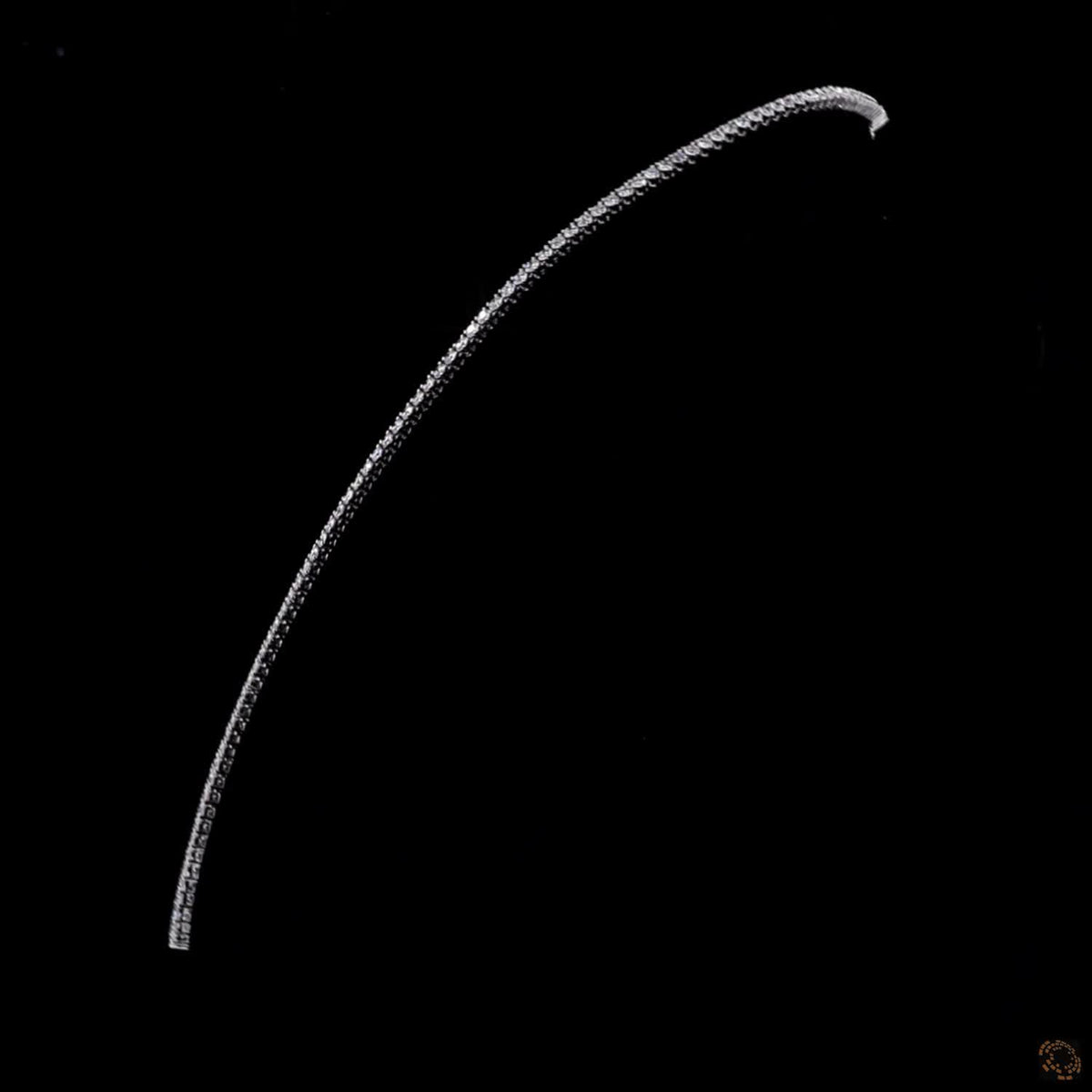 9.74 Ct Graduated stones range from subtle accent carats near the clasp to larger carat sizes along the center focal curve