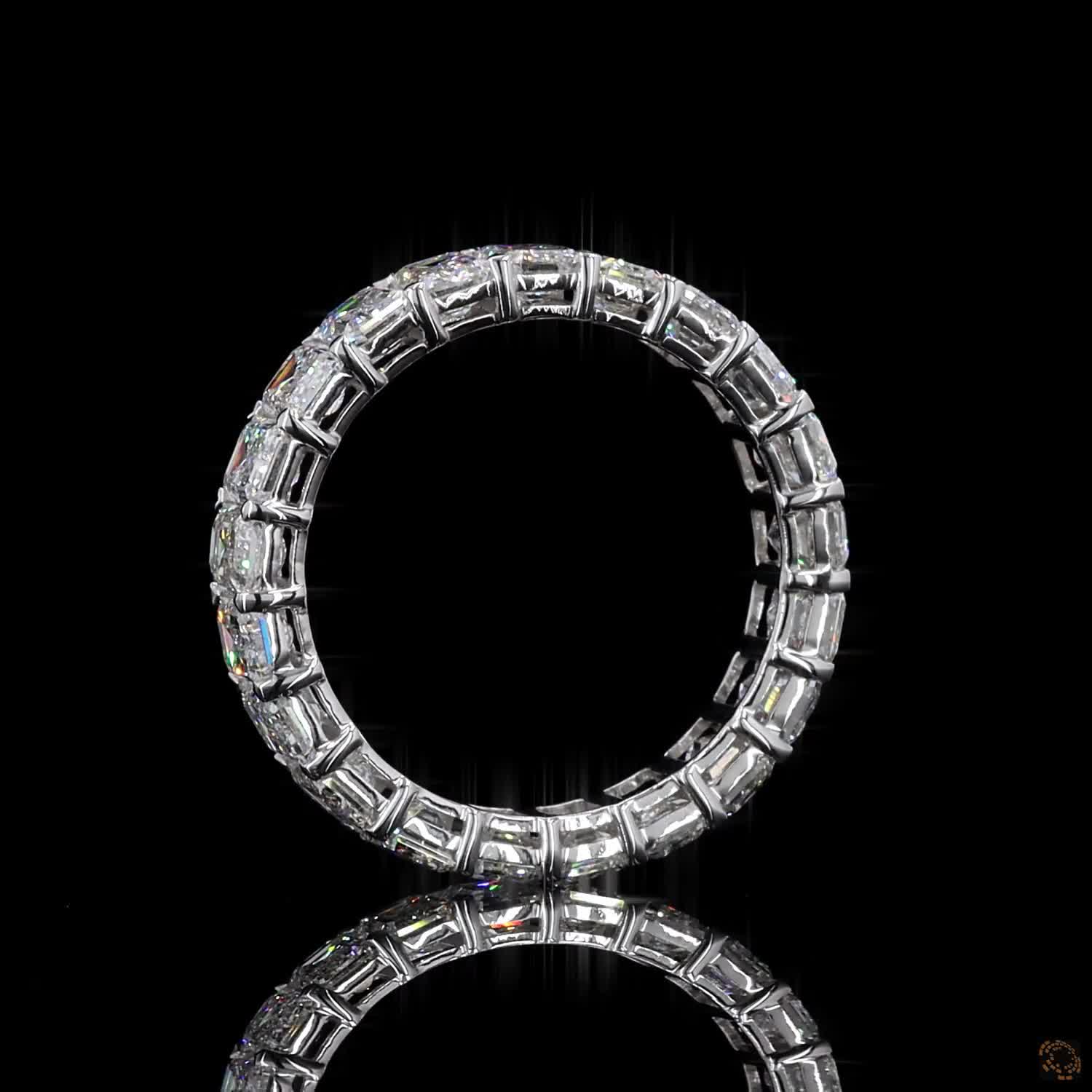 5.39 Ct Step-cut Emerald Diamonds continuously set around the full band