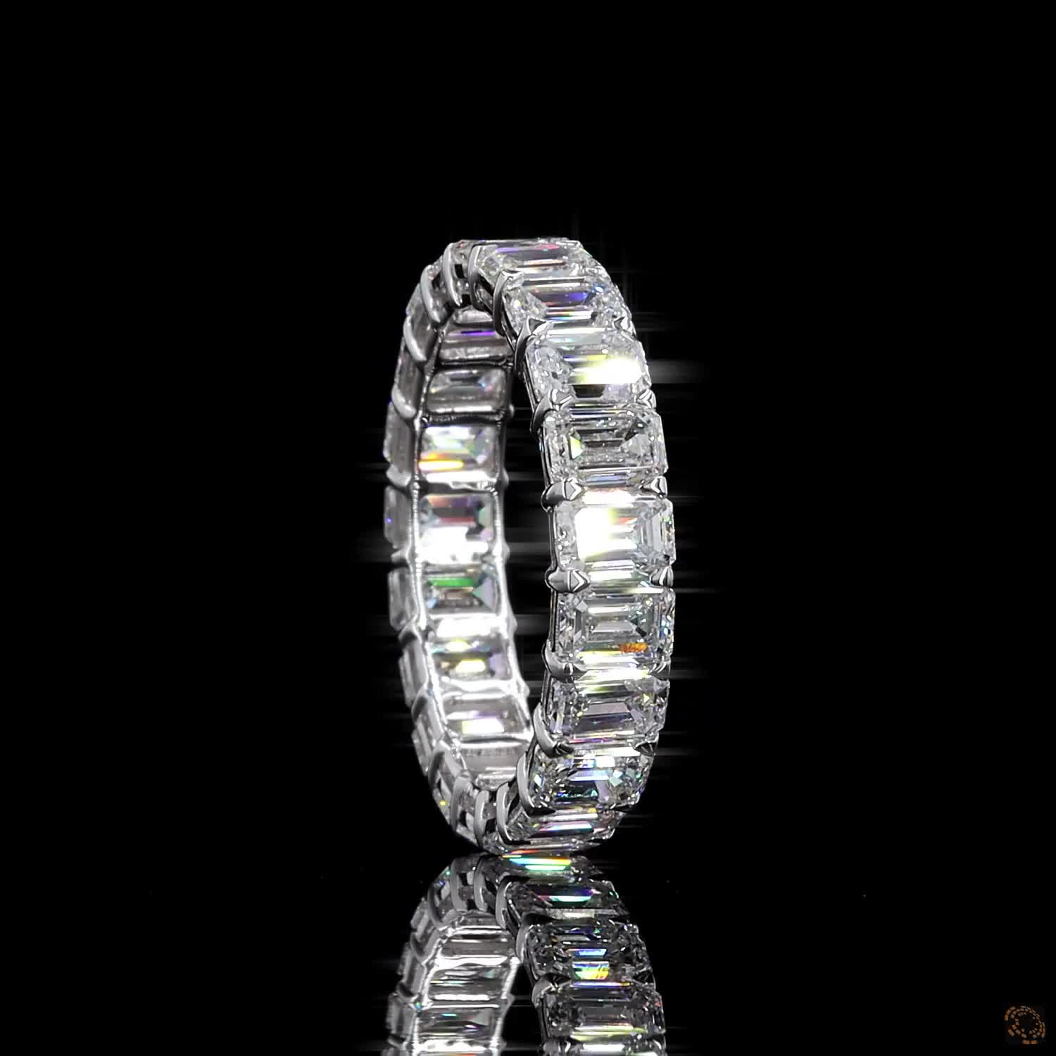 5.39 Ct Step-cut Emerald Diamonds continuously set around the full band
