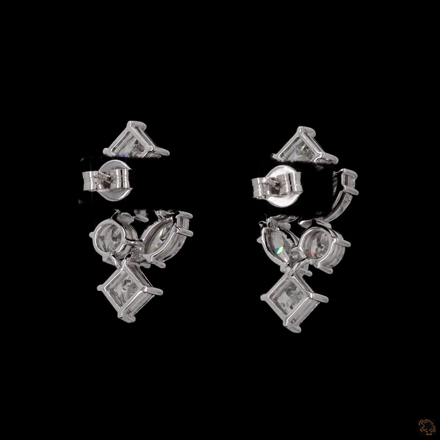 5.6 Ct Vertical cascading cluster capped at the top and bottom by kite-set princess-cut diamonds, sandwiching an alternating pattern of marquise and round brilliant stones