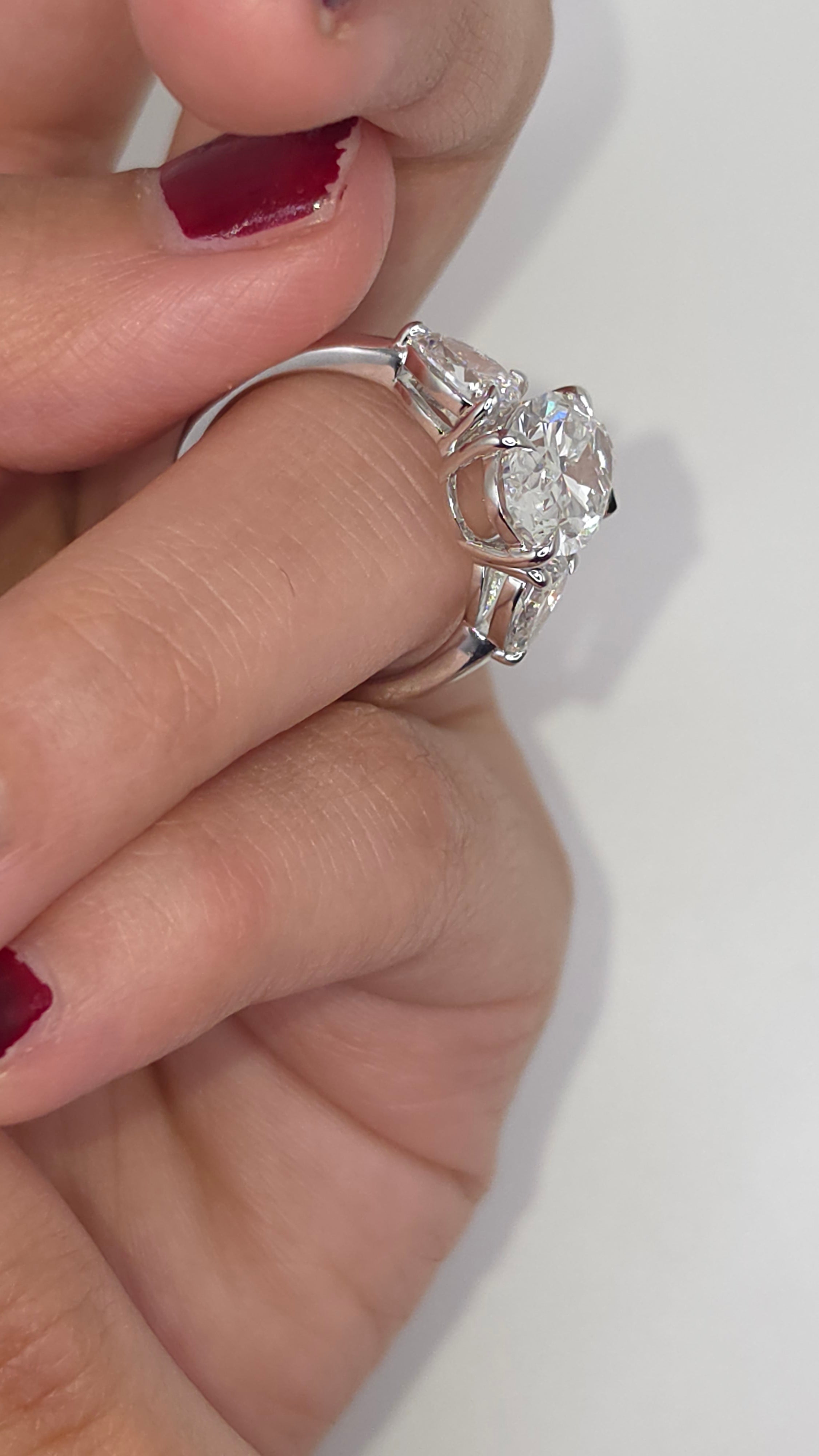 4.49 Ct Luxury Oval Solitaire Ring with Pear Side Stones