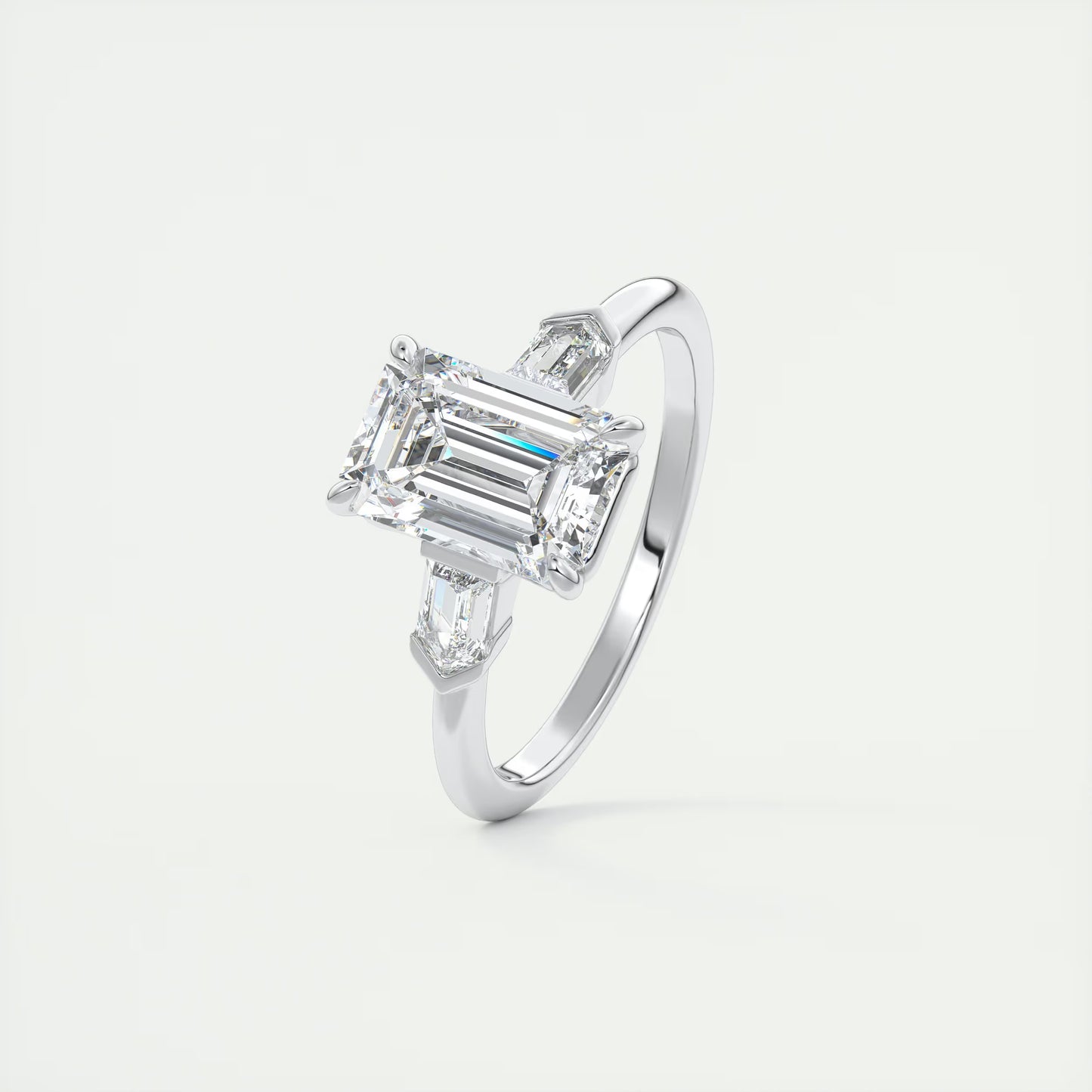 2.30 Ct Plunge Emerald & Bullets Three Stone Engagement Rings