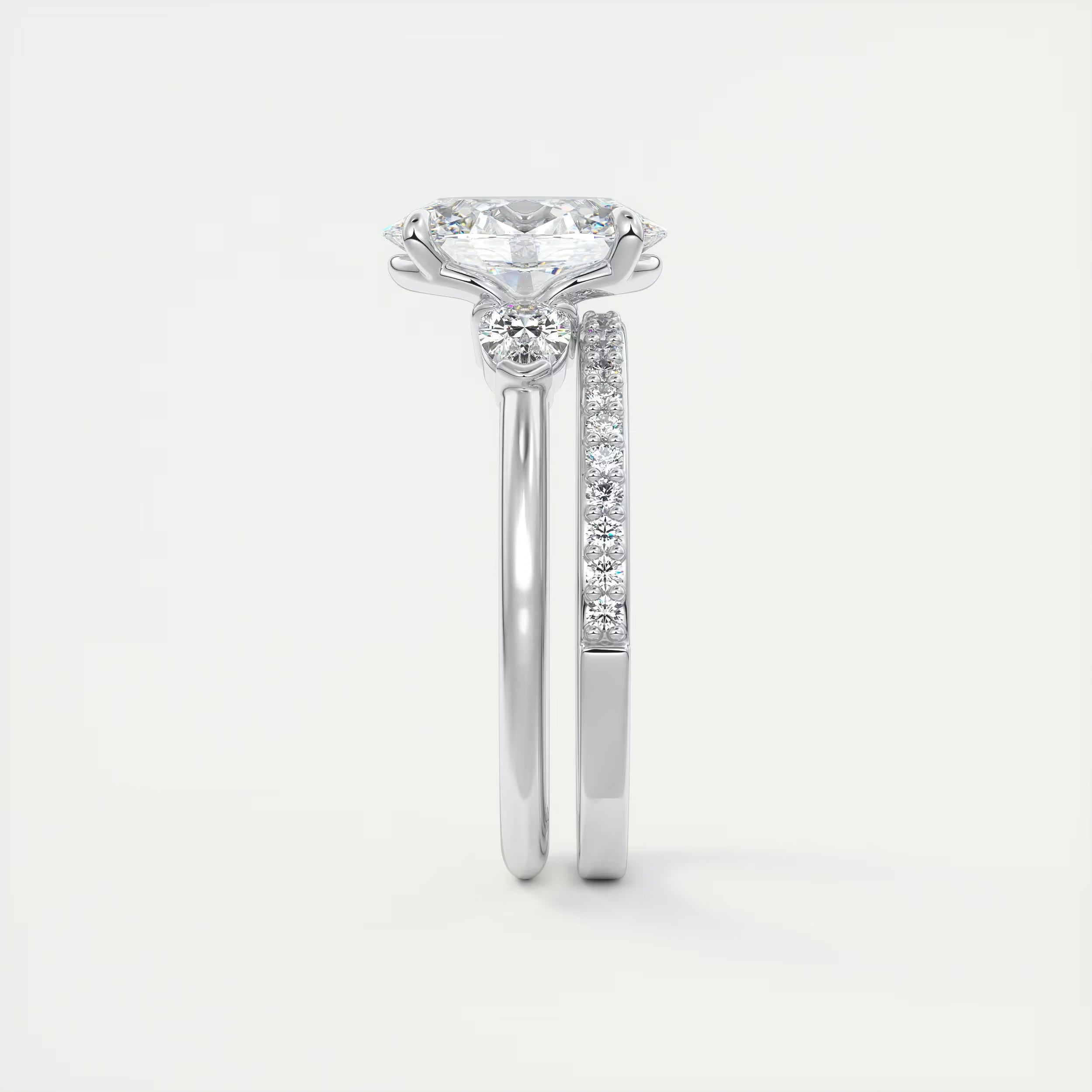 2.25 Ct Plunge Center Stone Oval & Side Stone Pear Engagement Rings