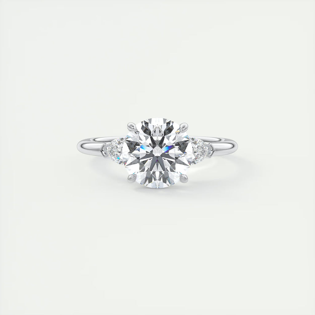 2.25 Ct Plunge Round & Pear Three Stone Engagement Rings