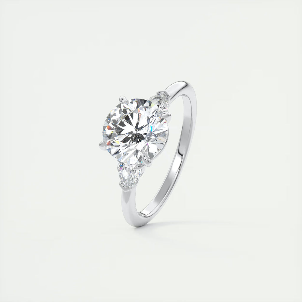 2.25 Ct Plunge Round & Pear Three Stone Engagement Rings
