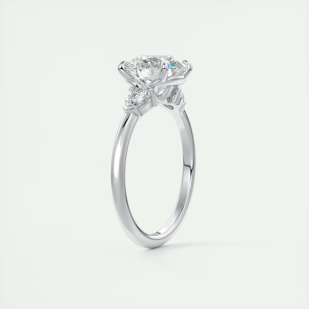 2.25 Ct Plunge Round & Pear Three Stone Engagement Rings