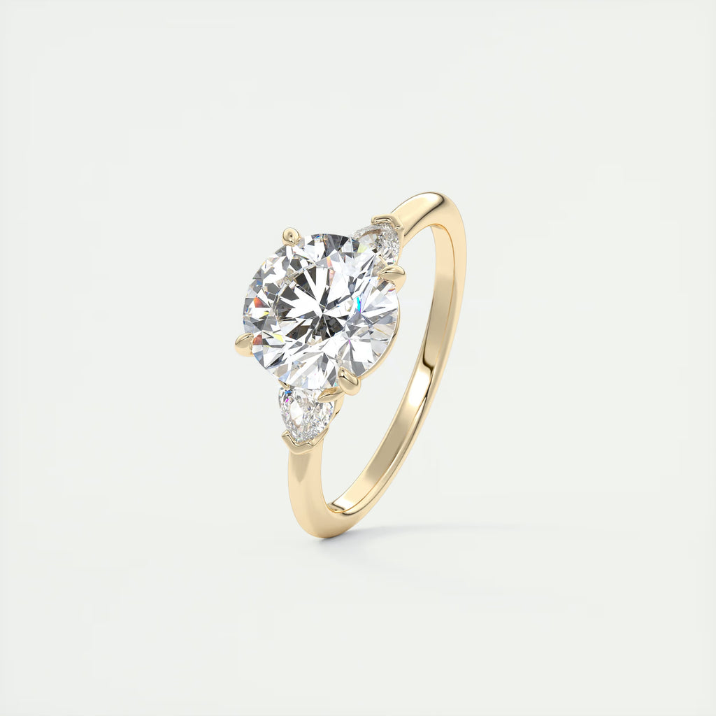 2.25 Ct Plunge Round & Pear Three Stone Engagement Rings