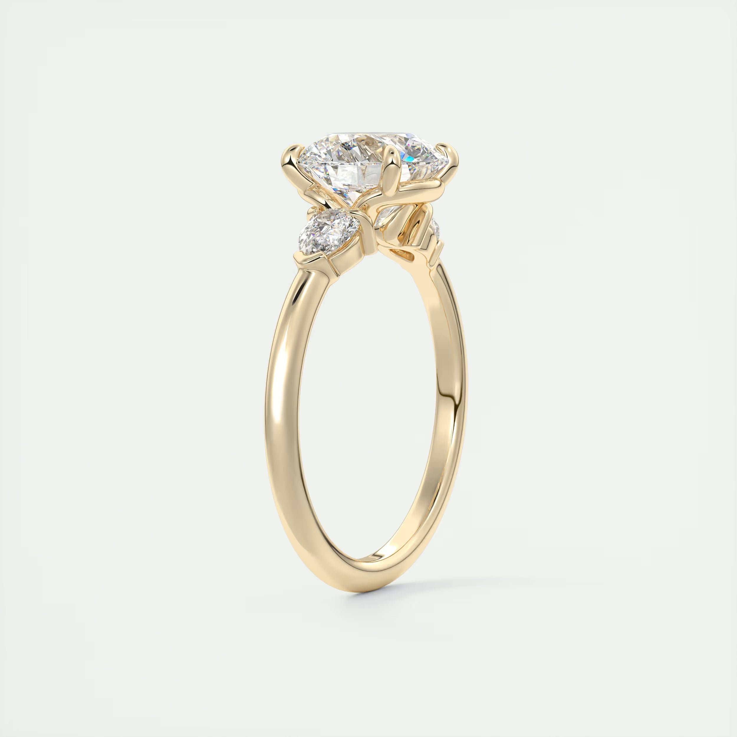 2.25 Ct Plunge Round & Pear Three Stone Engagement Rings